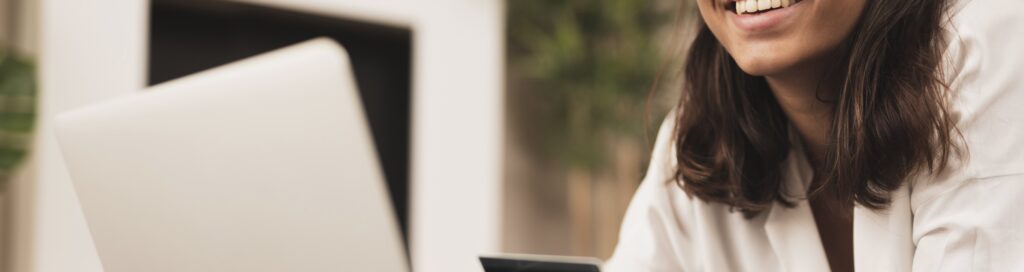hands-working-laptop-holding-card-floor